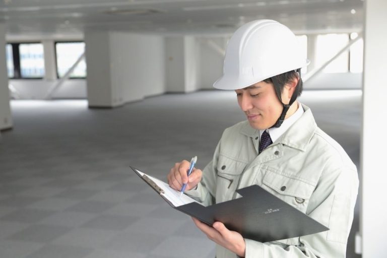 Construction Worker Inspecting Plans