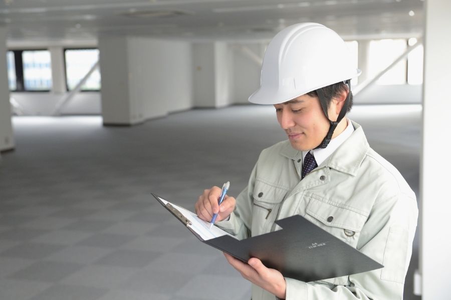 Construction Worker Inspecting Plans